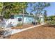 Charming cottage-style home with well-manicured lawn and inviting picket fence at 5051 5Th S Ave, St Petersburg, FL 33707