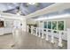 Elegant interior showcasing tile floors, staircase, and abundant natural light from large windows at 5051 5Th S Ave, St Petersburg, FL 33707