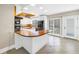 Well-appointed kitchen with white cabinets, a kitchen island, and modern black appliances at 5051 5Th S Ave, St Petersburg, FL 33707