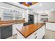 Functional kitchen featuring white cabinets, an island, and modern appliances at 5051 5Th S Ave, St Petersburg, FL 33707