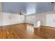 Bright living room featuring hardwood floors, ceiling fan, and ample natural light at 5051 5Th S Ave, St Petersburg, FL 33707