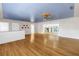 Large living room showcasing hardwood floors, a unique ceiling, and an open floor plan at 5051 5Th S Ave, St Petersburg, FL 33707