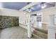 Living room with blue ceiling, stone accent wall and tile flooring at 5051 5Th S Ave, St Petersburg, FL 33707