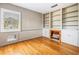 Cozy living room featuring built-in bookshelves, fireplace, and hardwood floors at 5051 5Th S Ave, St Petersburg, FL 33707