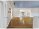 Spacious living room with beautiful hardwood floors, natural light, and open layout at 5051 5Th S Ave, St Petersburg, FL 33707