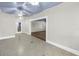 Living room with tile floors, ceiling fans and white walls and trim at 5051 5Th S Ave, St Petersburg, FL 33707
