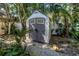 Backyard shed for extra storage surrounded by plants and landscaping at 5051 5Th S Ave, St Petersburg, FL 33707