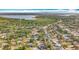 Scenic aerial view of the neighborhood, showcasing the surrounding trees and lake at 5100 Aragon S Way, St Petersburg, FL 33705