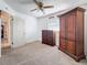 Bedroom with brown carpet, wooden furniture, white walls, and a ceiling fan at 5100 Aragon S Way, St Petersburg, FL 33705