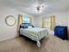 Comfortable bedroom with a ceiling fan and natural light from the windows, great for relaxation at 5100 Aragon S Way, St Petersburg, FL 33705