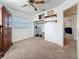 Neutral bedroom featuring a ceiling fan, open closet with shelving, and doorway to another room at 5100 Aragon S Way, St Petersburg, FL 33705