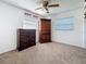 Well-lit bedroom with neutral walls and dark wood furniture at 5100 Aragon S Way, St Petersburg, FL 33705