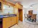 Bright kitchen features double sink, and a view to the dining room at 5100 Aragon S Way, St Petersburg, FL 33705
