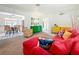 Inviting living room with colorful decor and dining area in the background, perfect for Gathering gatherings at 5100 Aragon S Way, St Petersburg, FL 33705