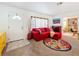 Cozy living room with a large window, creating a warm and inviting atmosphere for gatherings at 5100 Aragon S Way, St Petersburg, FL 33705