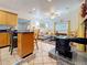 Charming living room connected to the kitchen, featuring a decorative fireplace and plenty of natural light at 5100 Aragon S Way, St Petersburg, FL 33705