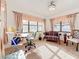Sun-lit study features neutral walls, large windows, and a decorative sofa at 5100 Aragon S Way, St Petersburg, FL 33705