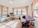 Bright study features neutral walls, large windows, and a plaid sofa at 5100 Aragon S Way, St Petersburg, FL 33705