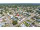 Aerial view of a cozy home featuring a pool, surrounded by lush landscaping and neighboring houses in a vibrant community at 5877 33Rd N Ave, St Petersburg, FL 33710