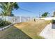 Fenced backyard featuring a lush lawn and an attractive bird bath at 5877 33Rd N Ave, St Petersburg, FL 33710