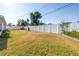 Large backyard featuring a white fence, providing privacy and security at 5877 33Rd N Ave, St Petersburg, FL 33710
