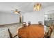 Open floor plan featuring a large wooden dining table with seating for six and access to kitchen at 5877 33Rd N Ave, St Petersburg, FL 33710