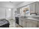 Bright kitchen with light-toned cabinetry, stainless steel sink, and black dishwasher at 5877 33Rd N Ave, St Petersburg, FL 33710