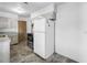 View of kitchen area featuring white refrigerator, stove, and tile floors at 5877 33Rd N Ave, St Petersburg, FL 33710