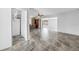Bright, open-concept living space featuring updated tile floors and natural light at 5877 33Rd N Ave, St Petersburg, FL 33710
