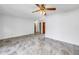 Spacious open living area boasts stylish tiled flooring, neutral paint, and a view to other rooms at 5877 33Rd N Ave, St Petersburg, FL 33710