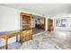 Living area featuring built-in shelving, adjacent to a dining room and sunroom at 5877 33Rd N Ave, St Petersburg, FL 33710