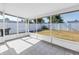 Enclosed porch overlooking the yard featuring screened walls and tiled floor at 5877 33Rd N Ave, St Petersburg, FL 33710