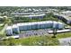 Aerial view of a condominium complex with lush landscaping and ample parking at 5970 80Th Street North # 206, St Petersburg, FL 33709