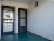 Covered front entry featuring two doors, one with a screen at 5970 80Th Street North # 206, St Petersburg, FL 33709
