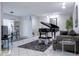 Combined living and dining area with a piano, sofa, and view to the screened lanai at 5970 80Th Street North # 206, St Petersburg, FL 33709