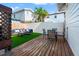 Inviting backyard featuring a mix of wooden decking and artificial turf, perfect for outdoor relaxation at 723 S Brevard Ave, Tampa, FL 33606