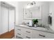 Elegant bathroom with double vanity, granite countertop, and walk-in shower at 723 S Brevard Ave, Tampa, FL 33606