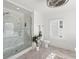 Bright bathroom featuring a walk-in shower with glass door and modern fixtures at 723 S Brevard Ave, Tampa, FL 33606