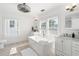 Bright bathroom featuring a modern soaking tub, double vanities, and ample natural light at 723 S Brevard Ave, Tampa, FL 33606