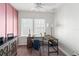Bright bedroom with desk and chair in front of windows with white trim at 723 S Brevard Ave, Tampa, FL 33606