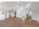 Finished attic featuring hardwood floors, lighting, and a partial bathroom at 723 S Brevard Ave, Tampa, FL 33606