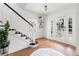 Bright entryway with hardwood floors, staircase, and a view of the front porch at 723 S Brevard Ave, Tampa, FL 33606