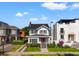 Charming two-story home featuring a red front door, lush landscaping, and classic architectural details at 723 S Brevard Ave, Tampa, FL 33606