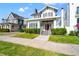 Charming two-story home with landscaped yard, red door, and inviting front porch at 723 S Brevard Ave, Tampa, FL 33606