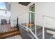 Inviting front porch with white railings and stairs leading to the entrance door at 723 S Brevard Ave, Tampa, FL 33606