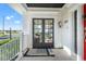 Charming front porch featuring a tile floor and French doors leading to the interior at 723 S Brevard Ave, Tampa, FL 33606