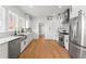 Modern kitchen with stainless steel appliances, marble countertops, and white cabinetry at 723 S Brevard Ave, Tampa, FL 33606