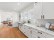 Beautiful kitchen with stainless appliances, white cabinets, and marble countertops at 723 S Brevard Ave, Tampa, FL 33606