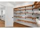 Spacious pantry with wooden shelving and easy access to the kitchen at 723 S Brevard Ave, Tampa, FL 33606