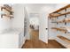 Spacious pantry with wooden shelving, marble countertops, and hardwood floors at 723 S Brevard Ave, Tampa, FL 33606